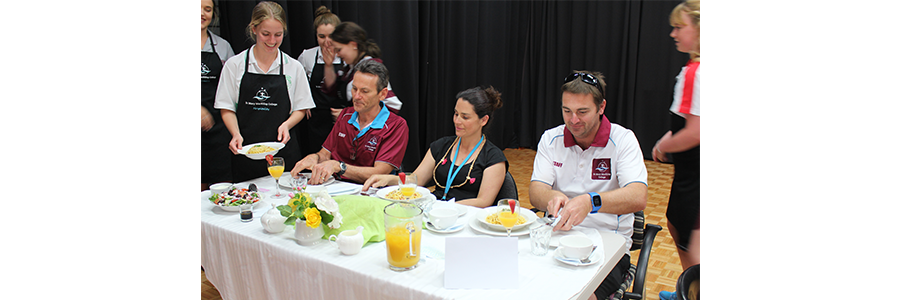 Staff guests at first Hunger Banquet